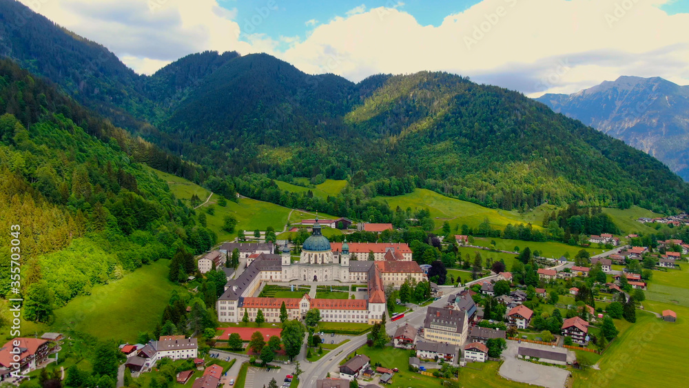 Obraz premium Ettal Abbey, called Kloster Ettal, a monastery in the village of Ettal, Bavaria, Germany - aerial photography