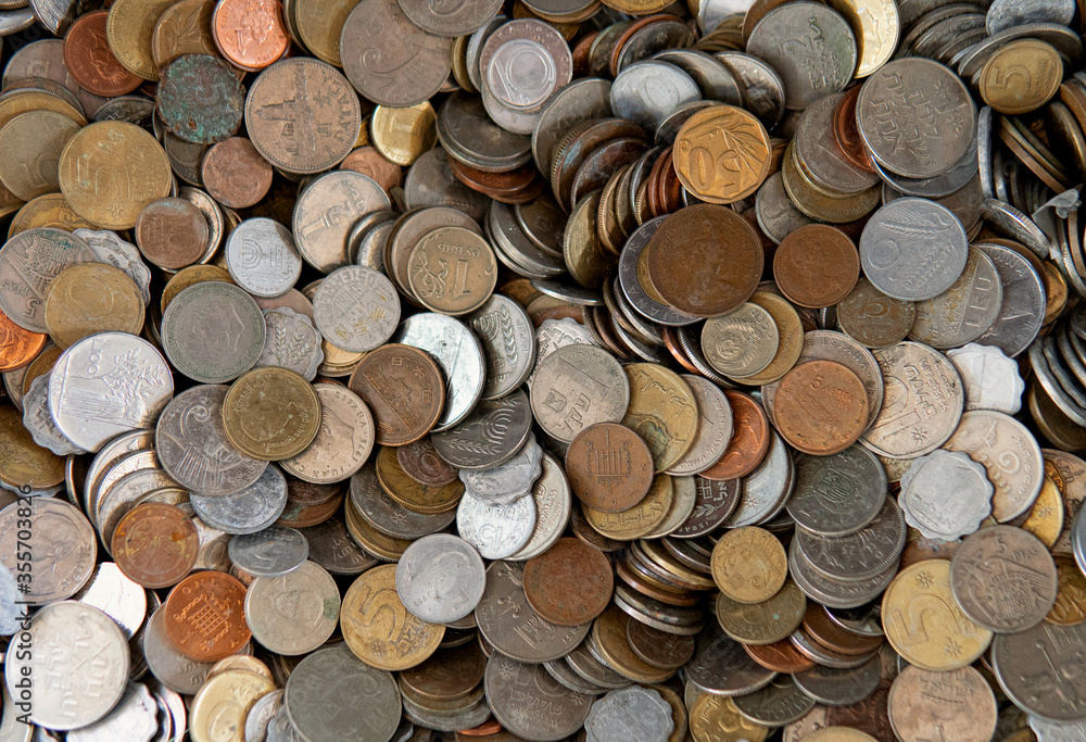 Background with big quantity of coins of different countries