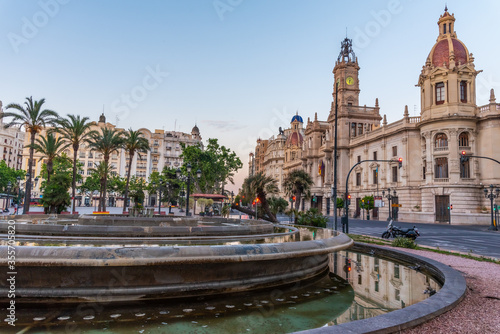 Town hall behind a fountain in Spanish town Valencia photo