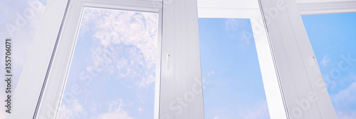 Obraz na płótnie Large white plastic window with blue sky panoramic w salonie