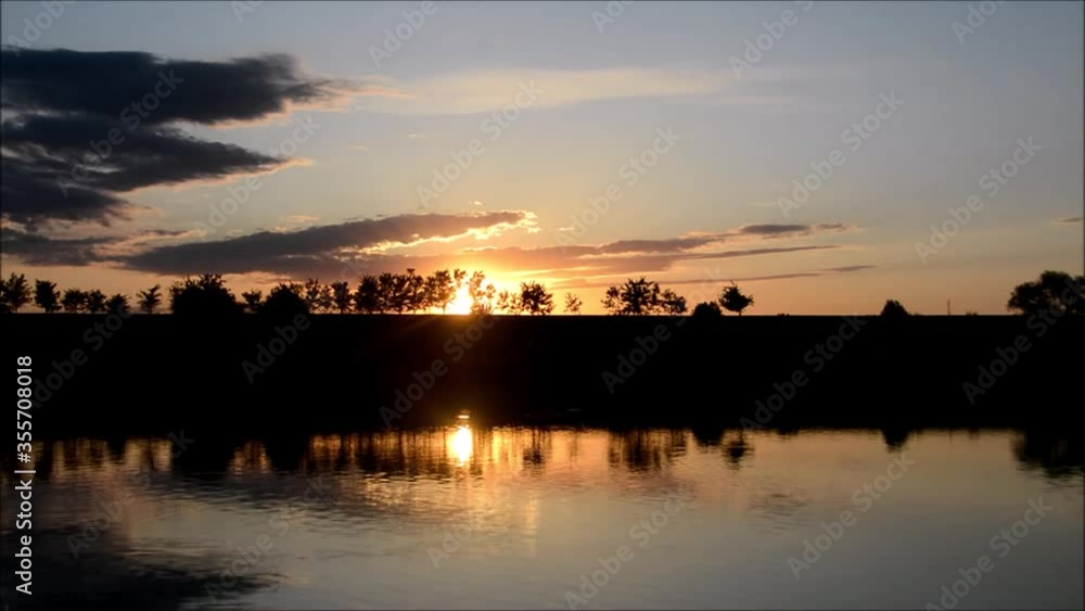 a sunset on the lake with chirping birds a sunset on the lake with chirping birds