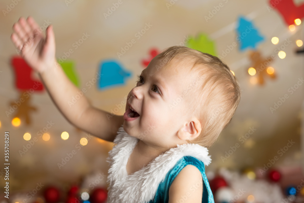 the child is happy with soap bubbles. new year's children's photos the child is happy with soap bubbles. new year's children's photos