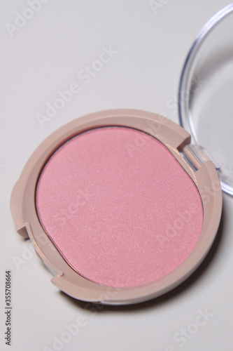 Pink powder blush for cheeks. Face cosmetics.