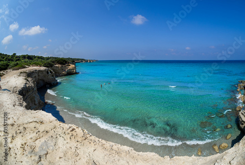 Seashore and blue clear water on the Italian coast in Tore de Saint Andreea in the summertime