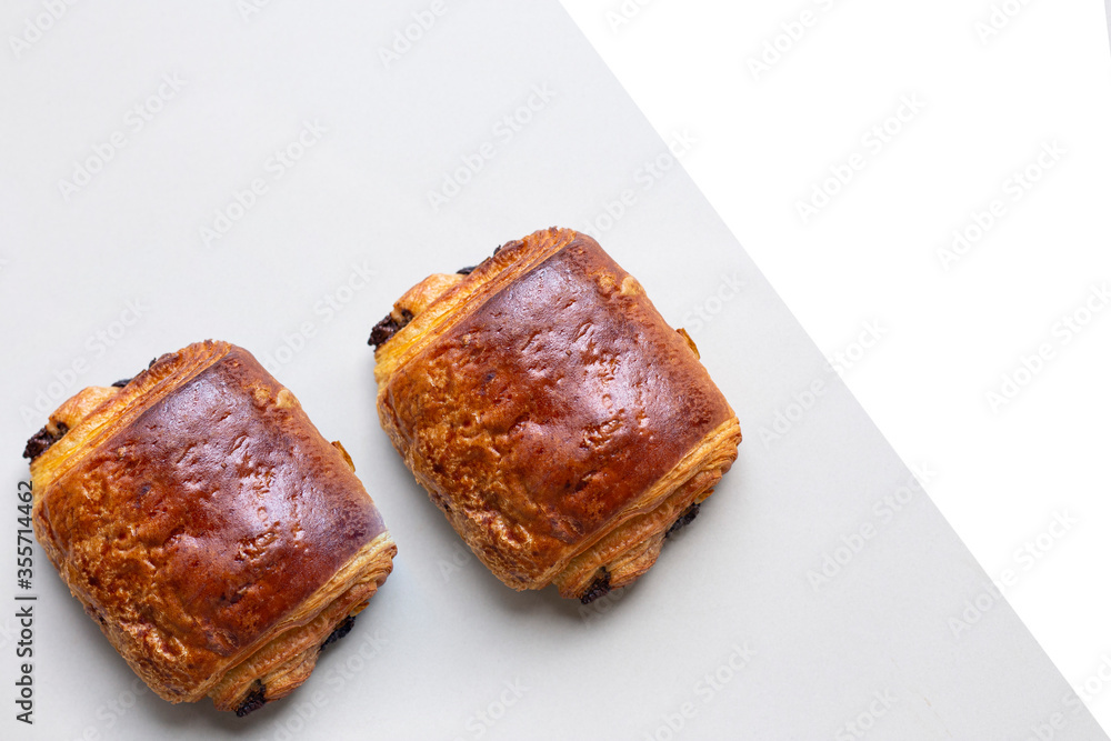 Homemade Chocolate Croissant on white marble. Homemade Chocolate Croissant on white marble.