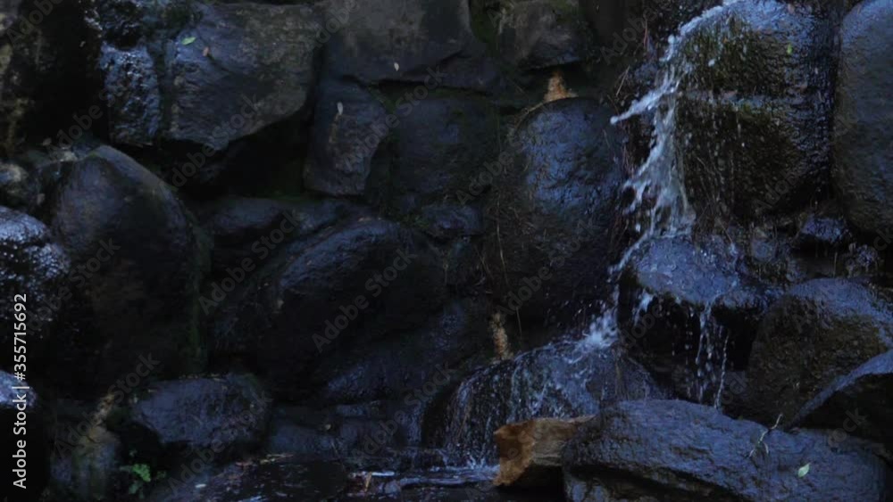 Crystal water waterfall cascade in forest slow motion Crystal water waterfall cascade in forest slow motion
