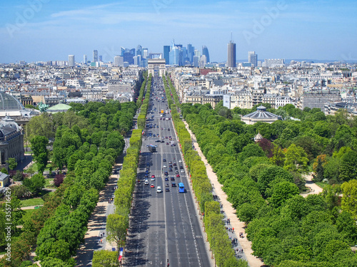 Photography Avenue des Champs-Élysées view from above with skyscrapers of La Défense on the
