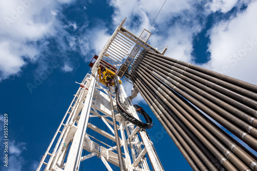 Canvastavla Oil rig derrick in oilfield against the bright blue sky