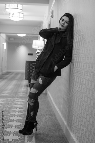 A young woman in the hallway.
