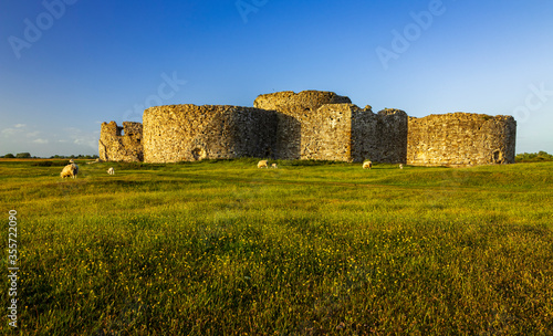 Catching the May sunset on the ruins of Camber Castle on marshland near Rye in East Sussex south east England