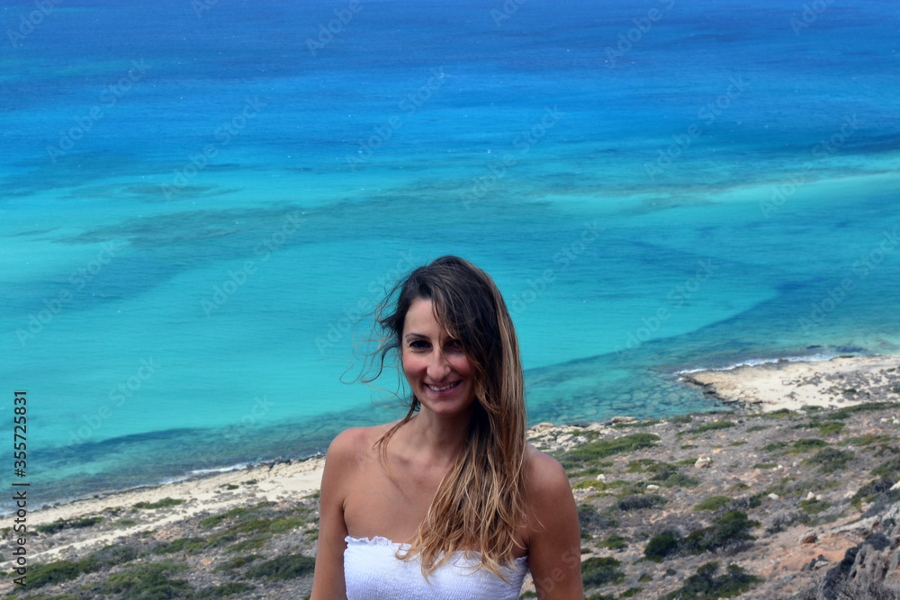 the happy girl in front of the crystal clear sea the happy girl in front of the crystal clear sea