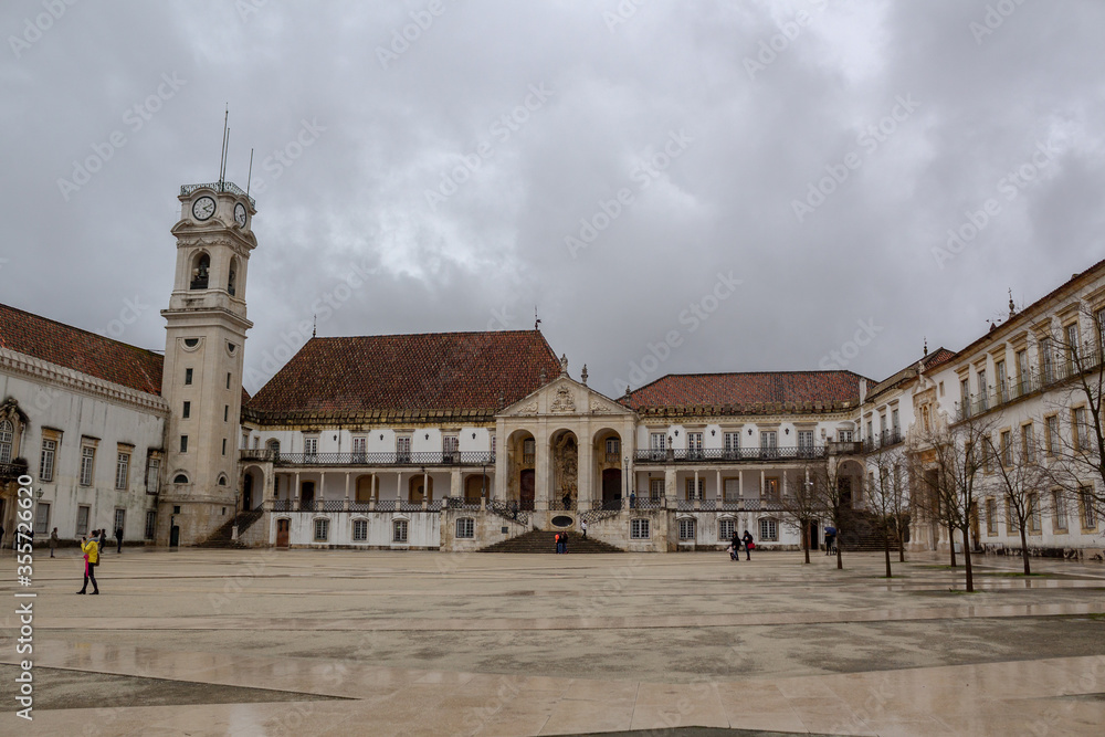 University of Coimbra and clock tower, on a day with many clouds
