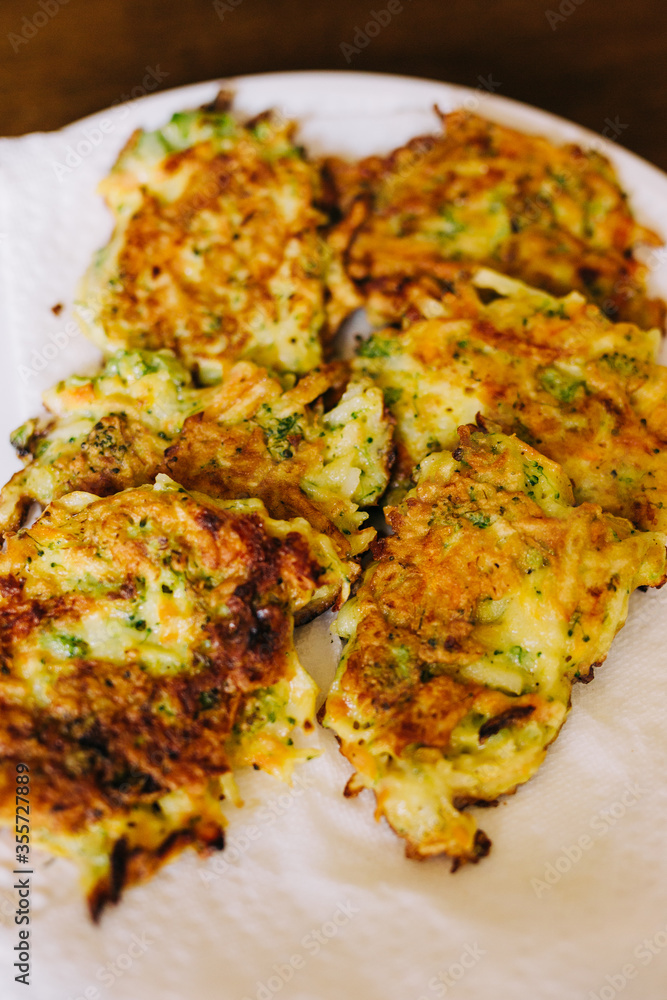 Fried Vegetable Fritters on a White Plate. These veggie fritters are made with flour, egg, and mixed vegetables. Fried Vegetable Fritters on a White Plate. These veggie fritters are made with flour, egg, and mixed vegetables.
