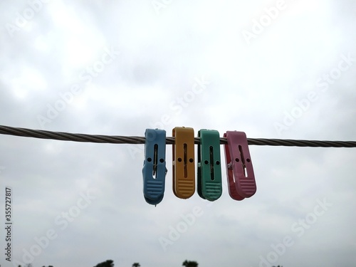 Photography Close up of some cloth hanging clips Stock Photo