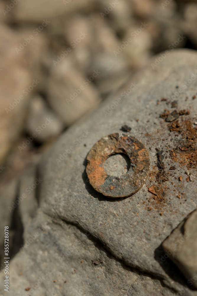 Rusty metal on a stone Rusty metal on a stone