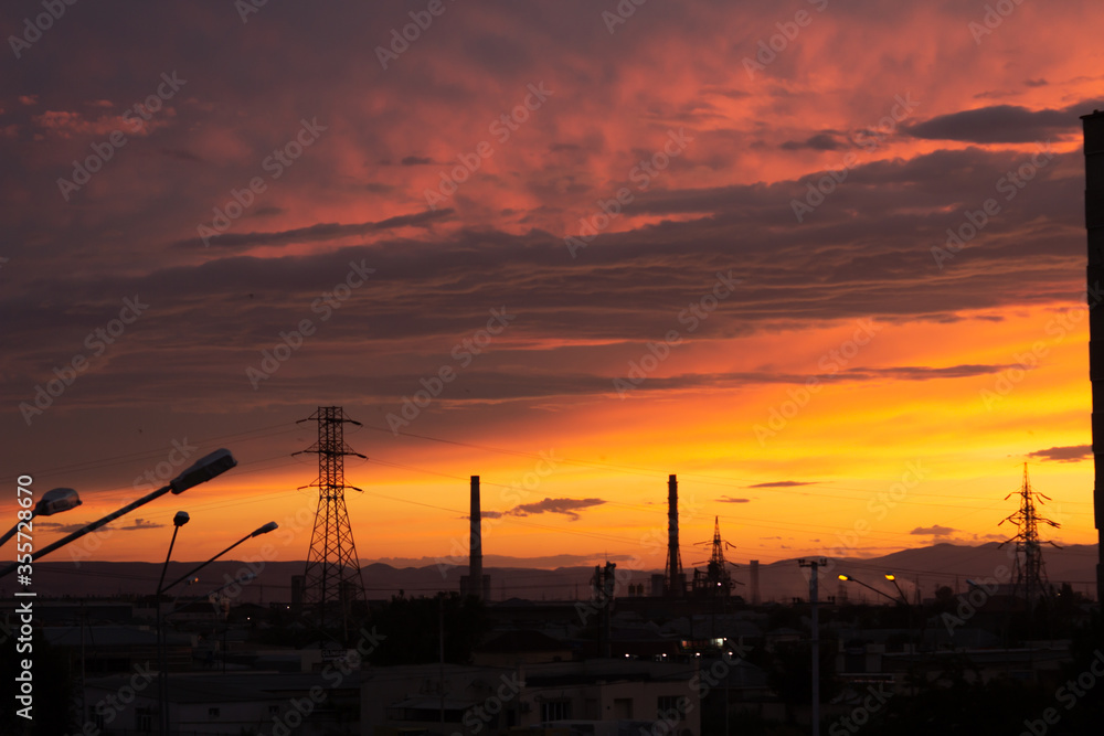 Beautiful sky at sunset with towering towers, lanterns, houses