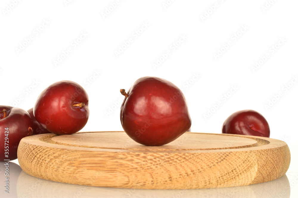 Fresh ripe, organic red plum, close-up, on a white background. Fresh ripe, organic red plum, close-up, on a white background.