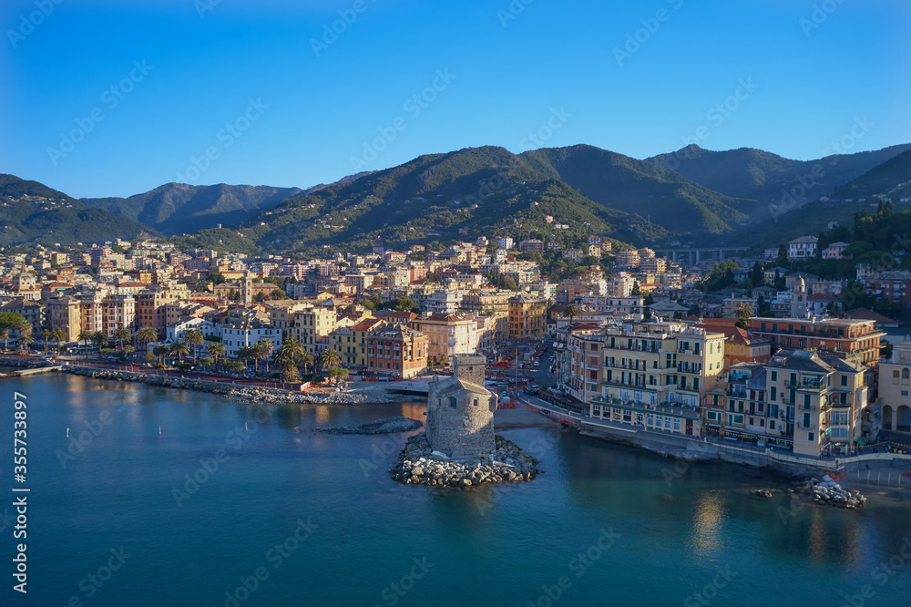 Panoramic aerial view of the bay of the tourist city of Rapallo, Genoa, Italy. Resorts in Italy. The architecture of the ancient city. Aerial photography with drone. Rapallo Castle