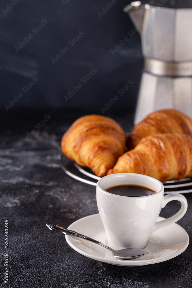 Breakfast with coffee and croissants