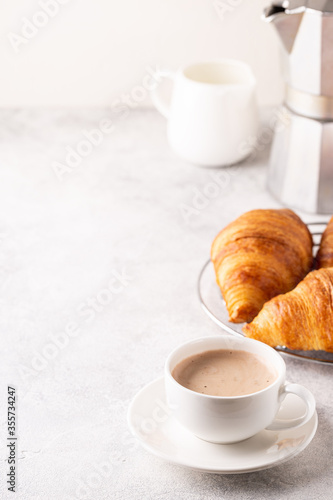 Fototapeta Naklejka Na Ścianę i Meble -  Breakfast with coffee and croissants