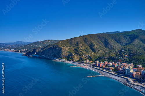 Fototapeta Naklejka Na Ścianę i Meble -  Panoramic aerial view of the resort town of Sestri Levante, Italy. Coastline, boats on the water. Summer season	
