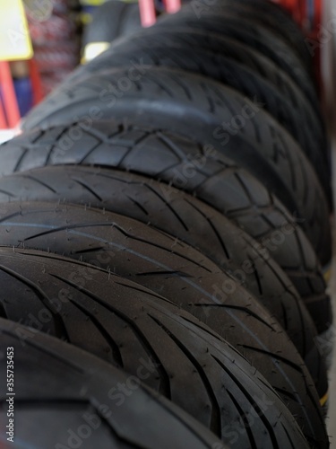 Motorcycle tires with a variety of motives in an automotive workshop
