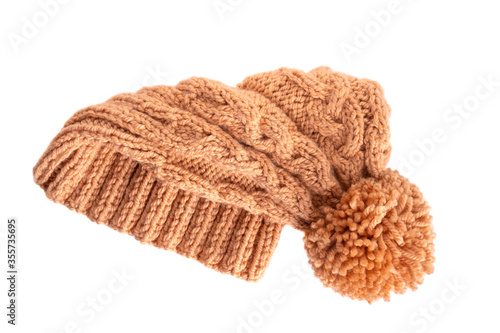 Handmade knitted winter hat on white background