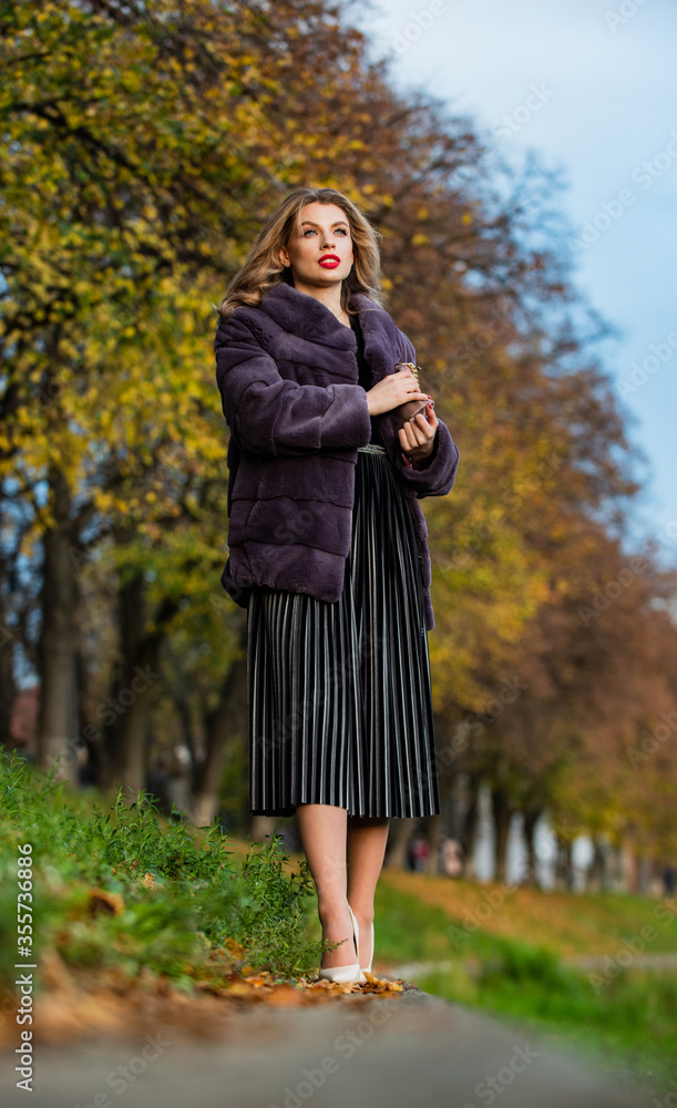 very wearable choice. bring out your glamorous side. step outside for a chilly walk. cosy autumn outfit. winter fashion trends. sexy woman red lips wear fur jacket. elegant businesswoman in fur coat very wearable choice. bring out your glamorous side. step outside for a chilly walk. cosy autumn outfit. winter fashion trends. sexy woman red lips wear fur jacket. elegant businesswoman in fur coat