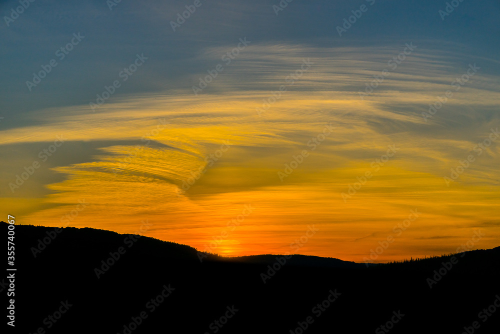 Fototapeta premium Breathtaking fire pastel sunset over the vineyards of Moselle river valley in Germany in Bernkastel-Kues