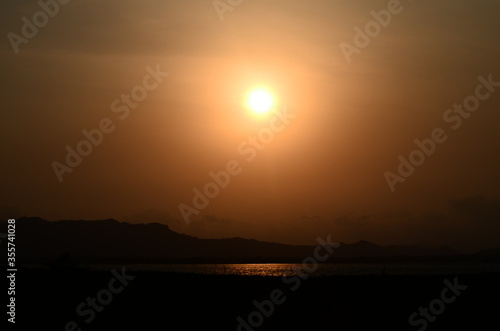 sunset over the river © Chinthaka Suraj