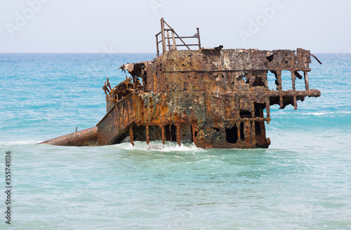 Obraz na plátně Rusty ship wreck remains surrounded by water near to Cyprus shores