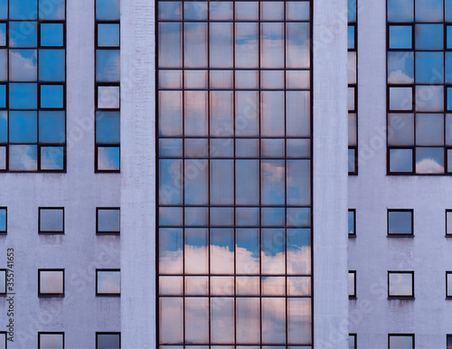 Symmetric windows of modern minimalistic building backdrop