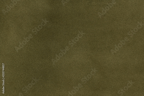 Olive green leather texture background. closeup view of suede