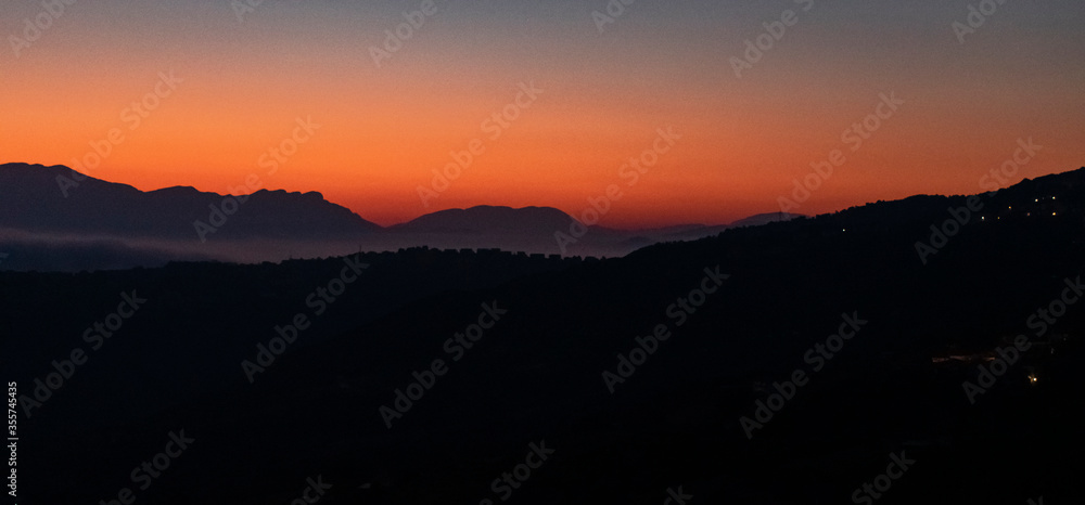 Italy, Campania, Laureana Cilento - 13 August 2019 - A spectacular sunrise seen from Laureana Cilento