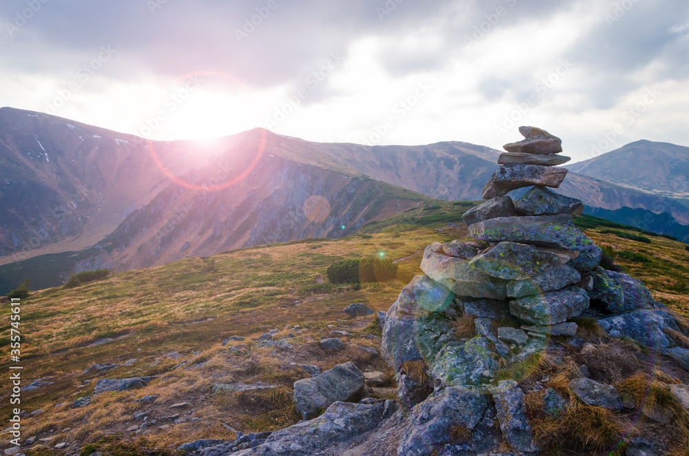 Fotografie Stone cairn on the mountain top.
