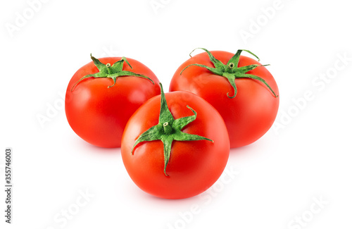 Three red round tomatoes on a white background. Isolated. Clipping path.