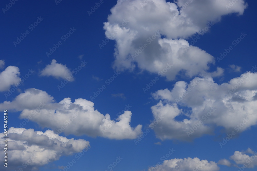 White clouds against the blue sky White clouds against the blue sky