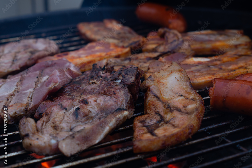 Close up images of barbecuing meat on a grill.