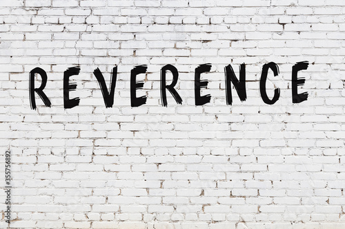 Photography Word reverence painted on white brick wall