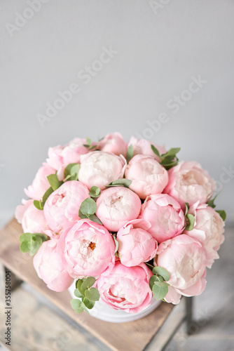 Pink peonies in pink round box. Beautiful peony for catalog or online store. Floral shop concept. Flowers delivery