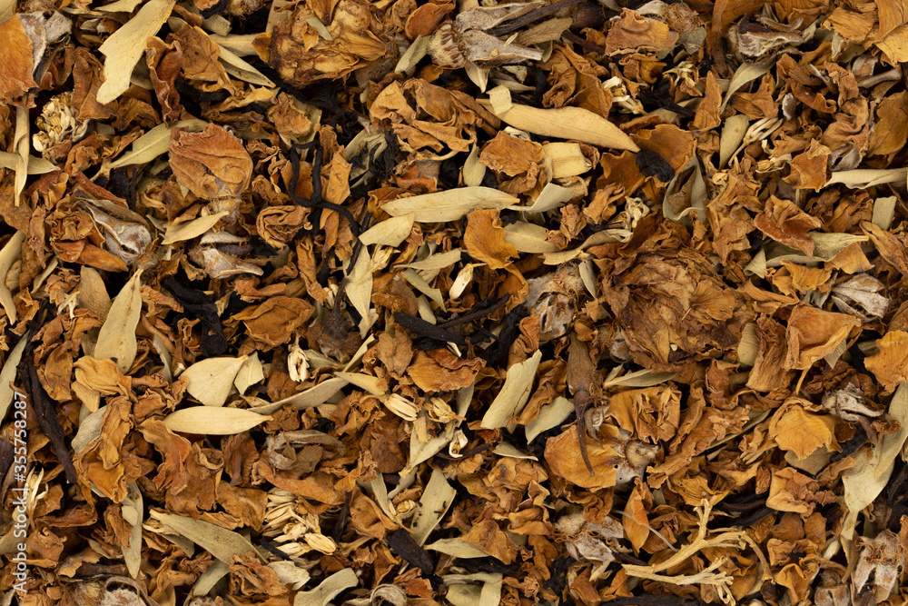 Dry tea with herbs, flowers, berries as background top view Dry tea with herbs, flowers, berries as background top view