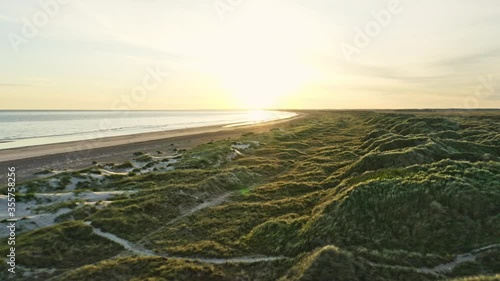 Awesome Sunrise Shot Along Slettestrand Beach in Jutland, Denmark photo