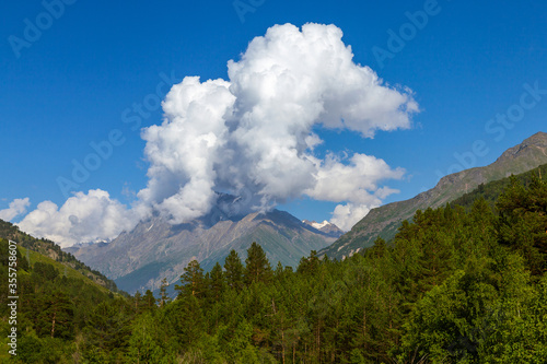 The cloud over the peak. Caucasus. Summer. photo