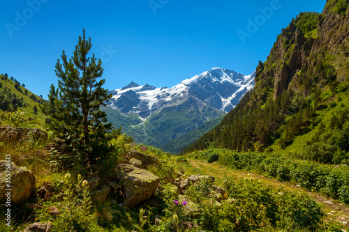 View of Mount Donguz-Orun and Kogutai and glacier "Seven." Summer. Elbrus. Caucasus.