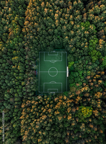 Aerial view of a soccer field in the forest