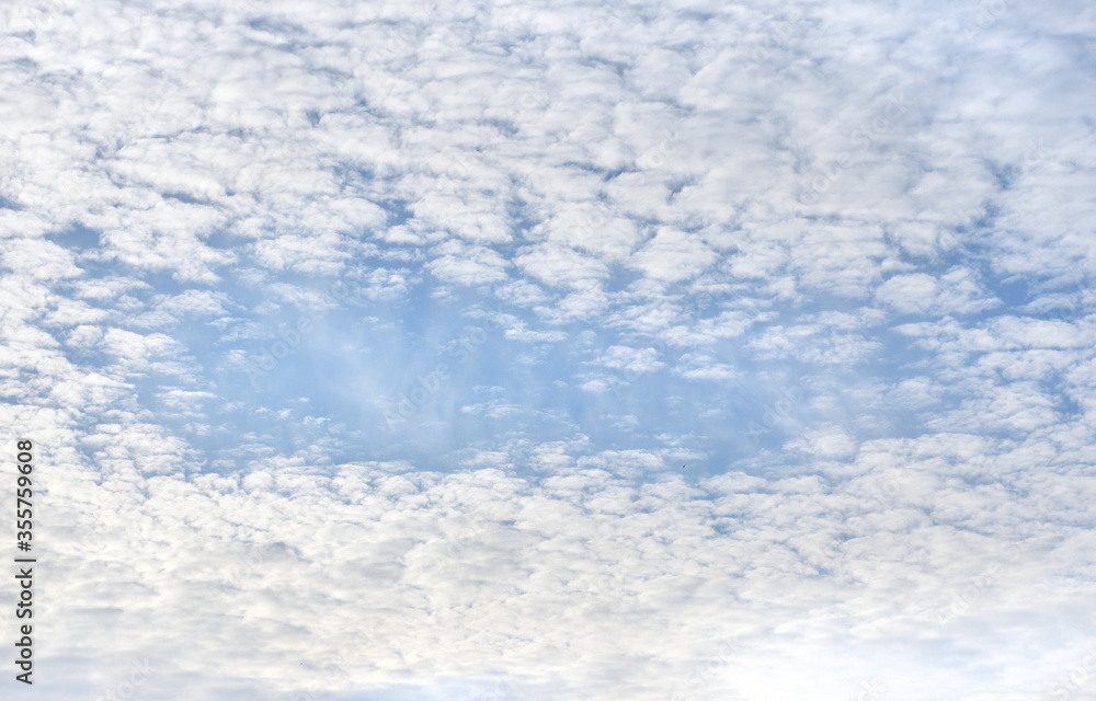 Beautiful cirrus clouds with blue sky in the center. Cloud frame Beautiful cirrus clouds with blue sky in the center. Cloud frame