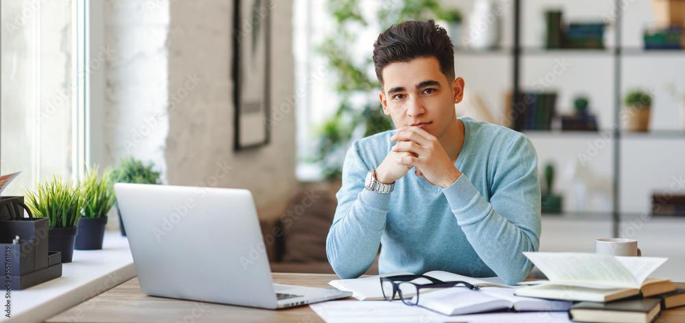 Ethnic freelancer working at home. Ethnic freelancer working at home.
