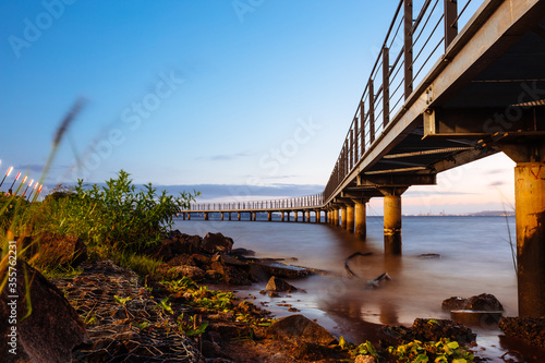 Sunset above the 
Walkway over Guaíba river, Porto Alegre, Brazil  photo