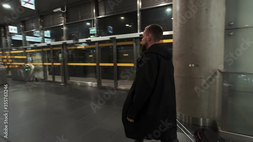 Wallpaper Mural Man with baggage moving up on escalator. Subway underground station Torontodigital.ca