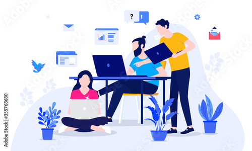 Small team working on project, creative leader pointing at computer screen, hipster programmer, and woman sitting on floor. Creative agency, marketing team, and user experience developers concept.